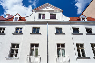 facade of a historic tenement house in the city of Poznan