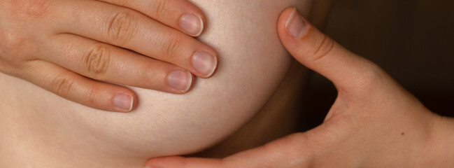 Unrecognizable Women topless doing self-checks for breast cancer. BSE Breast cancer self check,...