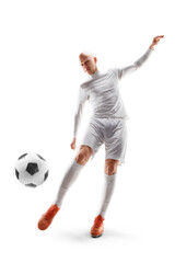 The football player hit the ball. Soccer. Professional soccer player hits the ball for the winning goal