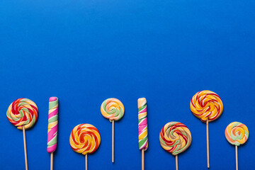Set of colorful lollipops on colored background. Summer concept. Party Happy Birthday or Minimalist...