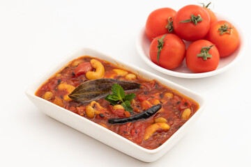 Sweet And Spicy Tomato Chutni Also Called Tamatar Ki Khatti Meethi Chatney Or Chutney Bhoger Prasadam Prepared From Fresh Tomatoes, Dry Fruits viz Kaju, Kismis And Spiced With Garam Masala