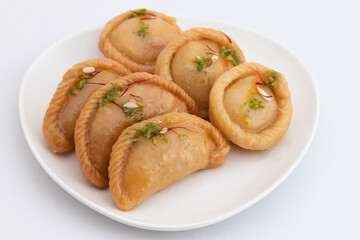 Chandrakala And Gujiya Mithai Also Called Suryakala, Gujia, Pirukiya, Pirukia, Pedakiya, Karanji, Basundi, Gughra Is Made Of Suji Ghee, Mawa Khoya Chasni Mava Khoa On Deepawali, Teez, Holi, Teej