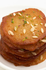 Juicy Sugary Pancakes Sweets Also Called Malpua, Pooa Or Pua Are Traditional Indian Dessert Mithai Drenched, Dunked, Soaked Or Dip In Sugar Syrup Cheeni Ki Chasni. Enjoyed On Holi, Navratri and Diwali
