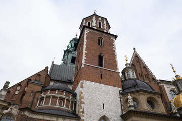 Fototapeta na wymiar Royal Wawel royal castle in Krakow in rainy early spring weather in Poland. historic castle in the old city Gardens and cathedra, Cracow, Poland. Travel attraction tourist destination