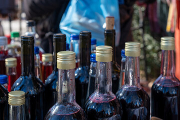 Bottlenecks in bright sunshine, street fair