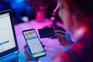 Modern woman making online shopping on e-commerce website