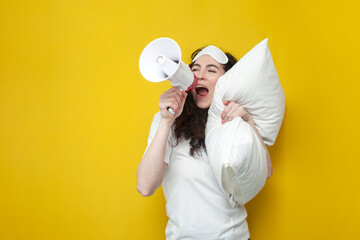 cute young girl in sleep mask holds soft pillow and shouts news into megaphone, woman announces...