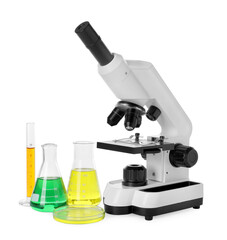 Laboratory glassware with colorful liquids and microscope isolated on white