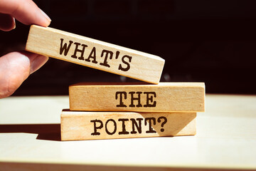 Wooden blocks with words 'What's the Point?'.