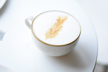 cup of coffee with foam in a white cup