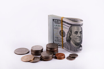 American coins and a stack of 100 dollar bills