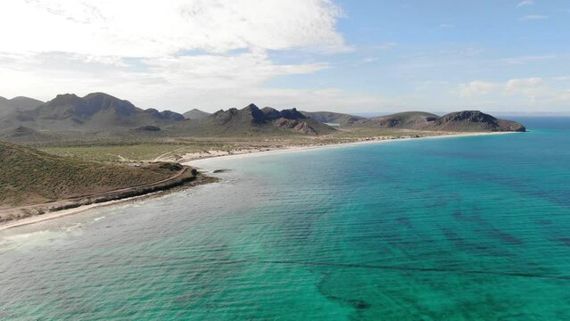 Aerial of turquoise shallow water at Tecolote Beach in Southern Baja, Mexico