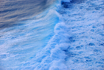Blue sea marine ocean seascape tropical huge wave on blurred background. Seascape blue ocean white wave motion outdoor. Aqua marine huge wave sea summer background. Paradise turquoise water landscape
