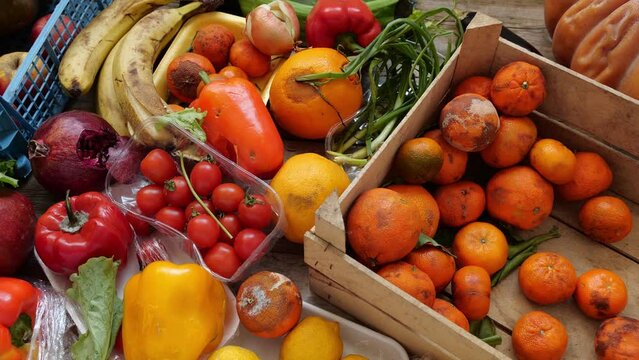 Unsold fruits and vegetables in plastic packaging were thrown into the landfill. Food waste, retail losses