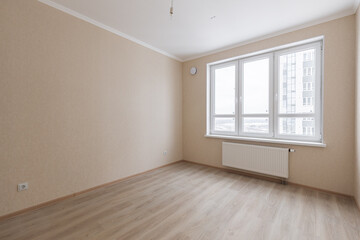 Empty gray room ready for people to move in