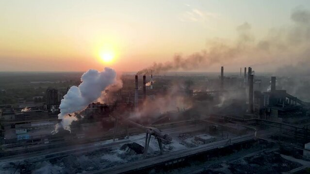 industry metallurgical plant sunrise bad ecology chimney smoke aerial 4K