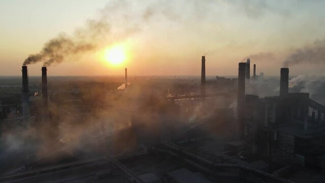 industry metallurgical plant sunrise bad ecology chimney smoke aerial 4K
