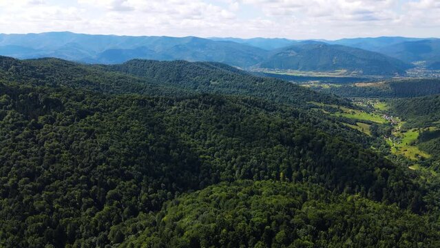 Cinematic aerial shot of an endless mountain and forest landscape in southern Slovenia