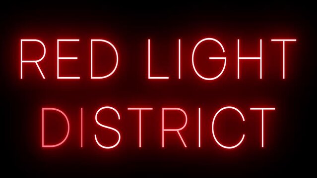 Flickering red retro neon sign glowing against a black background
