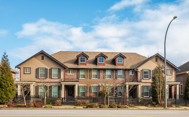 Modern residential houses neighborhood street in a suburban residential area. New and comfortable...