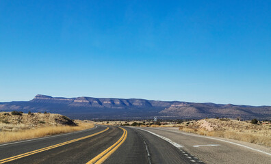 Fototapeta na wymiar road in the desert to the mountain