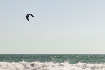 person practicing kiteboarding on the coast of Arica