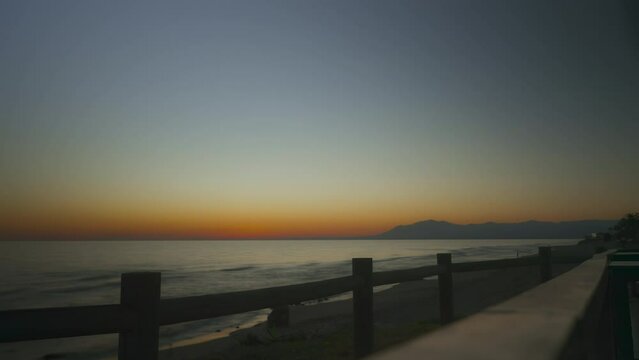 Cabopino beach sunset timelapse with a clear sky. Malaga, Spain