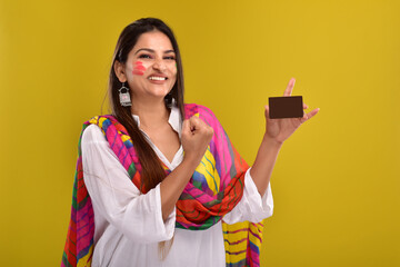 Portraits of  Young Woman celebrating holi