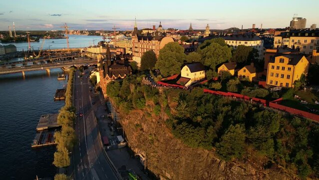 Mariaberget Stockholm Sweden. Sunset golden hour. Slow aerial orbit.