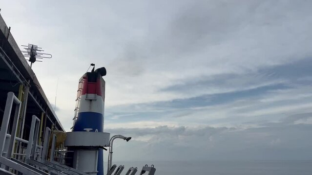 Ship exhaust smoke gas emissions from large ferry, Marine diesel engine exhaust gas from combustion, Gas Emission Air Pollution from transportation. Green house effect, pollution concept 4k