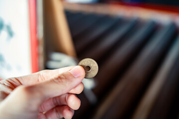 5 yen coin was used for toss into an offering box in Japanese temple.