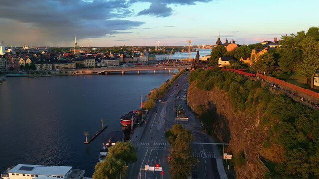 S&ouml;der M&auml;larstrand, Stockholm, at Mariaberget in golden hour. Forward drone shot.