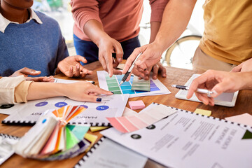 Hands, documents and strategy with a designer team working on a creative project together in the...