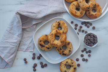 sweet home made chocolate chip donuts on a table