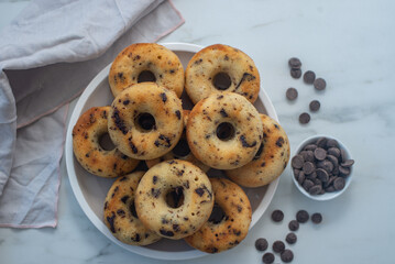 sweet home made chocolate chip donuts on a table