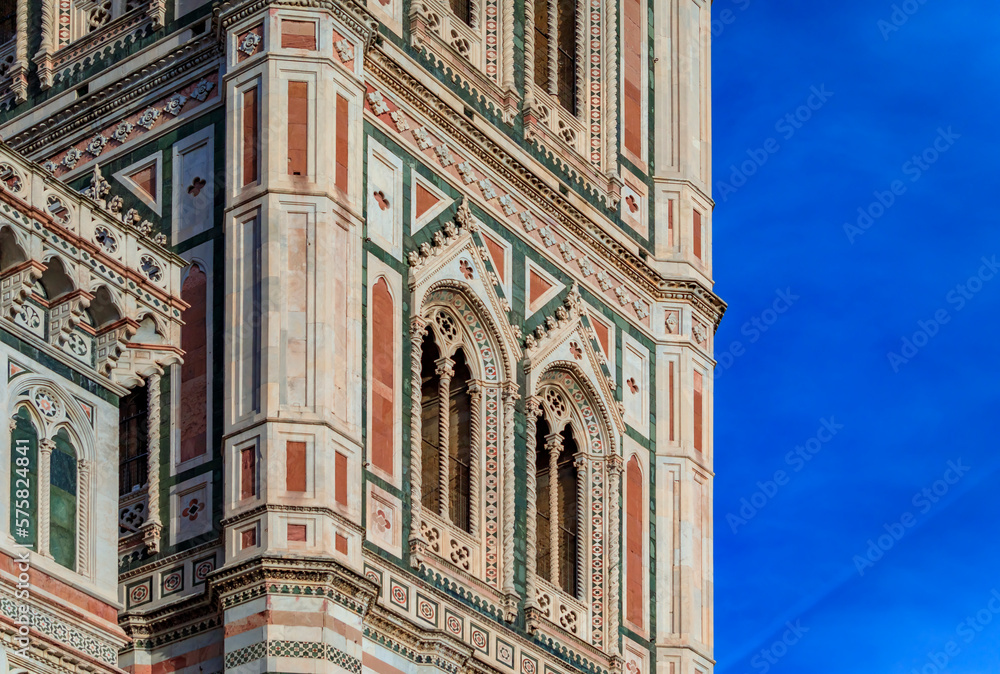 Poster marble facade of giotto campanile bell tower at the duomo in florence, italy.