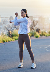 Fitness, arm and stretching by woman in road for running, training and exercise at sunset, body or...