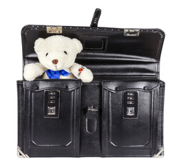 Black retro leather schoolbag with teddy bear isolated