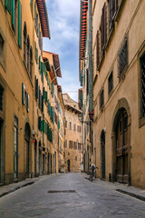 Gothic buildings on a narrow street in Centro Storico of Florence, Italy