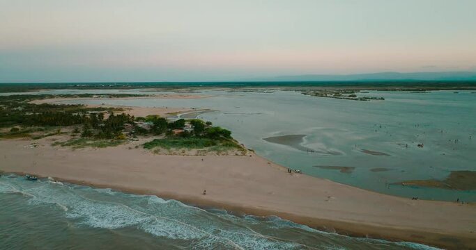 Aerial shot of the beach and the river on sunset, Colombia, la guajira