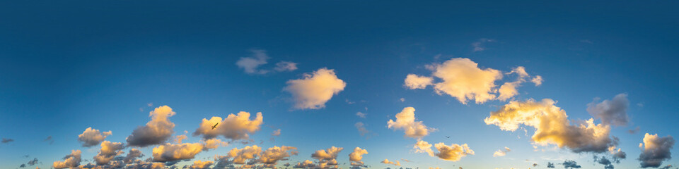 Dark blue sunset sky panorama with Cumulus clouds. Seamless hdr pano in spherical equirectangular format. Complete zenith for 3D visualization, game and sky replacement for aerial drone 360 panoramas.