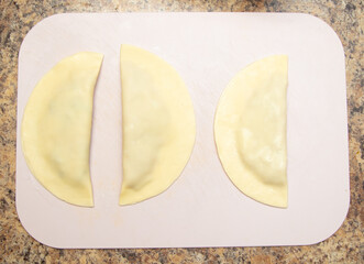 Cooking chebureks from dough and minced meat.
