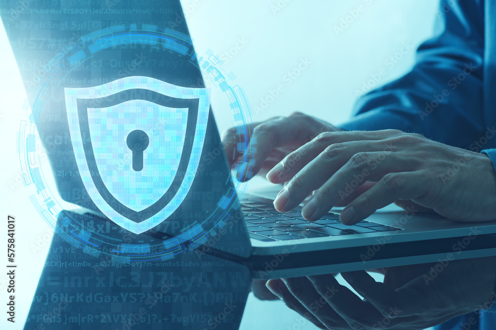 Poster personal data protection system. shield icon and laptop. closeup of hands typing.