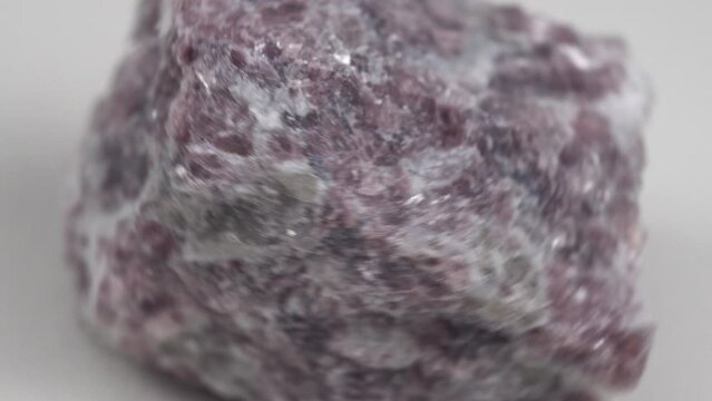 Mineral stone lepidolite. Macro shooting of natural gemstone. The raw mineral.