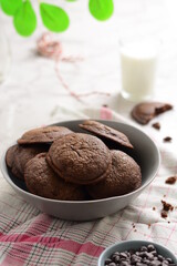A cup of milk and brownies cookies