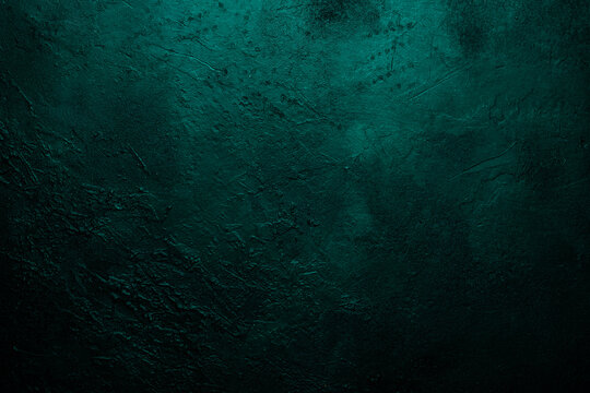 Deep emerald green texture or background with stains, waves and grain elements. Image with place for text. Template for design