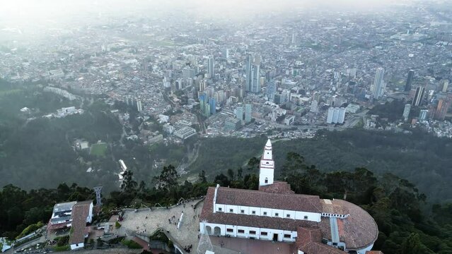 Majestic views of the center of Bogotá from Monserrate, aerial views from a drone, Impressive church on the mountain overlooking the city of Bogotá