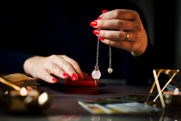 Blurred tarot cards on the table, esoteric concept, fortune telling predictions