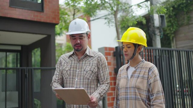 contractor and worker put on helmet for safety and talk with on construction building factory project,Concept of engineer civil team work,Leadership and business workflow of new building