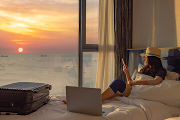 Travel Insurance Website,Travel insurance is intended to cover medical expenses, other losses incurred while traveling. Woman with bandage on knee sitting on bed with a beautiful nature outside window
